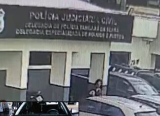 mulher-picha-carro-de-policial-com-simbolo-do-cv-na-frente-de-delegacia
